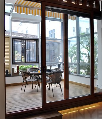 Puerta corredera de patio de aluminio de acabado liso recubierta con vidrio de templado simple o doble