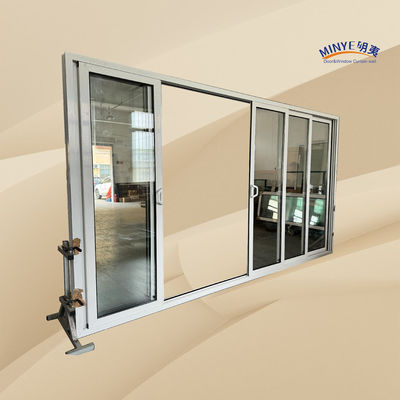 Puerta corredera de aluminio de corte térmico exterior con apilador y vidrio doble templado